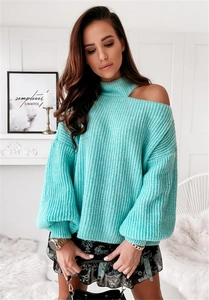 Close-up of light blue knit sweater featuring stylish high neck and shoulder cut-out detail