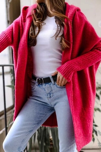 Close-up of rose red hooded knit cardigan showing chunky knit texture and drop shoulder