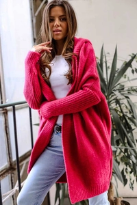 Detail of rose red hooded knit cardigan with chunky stitch texture and batwing sleeves