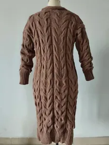 Detailed back view of a dark brown cable knit long sweater dress with thick texture