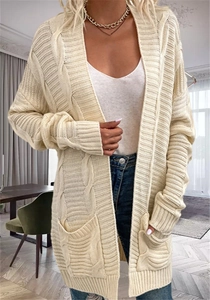 Detail of beige cable knit cardigan featuring textured pattern and side pockets