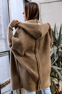 Macro detail of brown oversized hooded knit cardigan with plush texture and back seam design