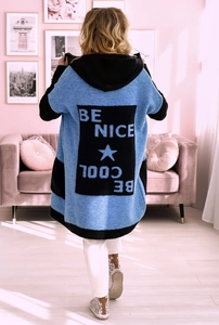 Detail of blue knit cardigan featuring BE COOL letter jacquard and star pattern on the back