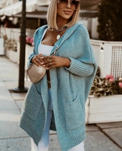 Detail view of light blue oversized hooded cardigan with large pockets and batwing sleeves