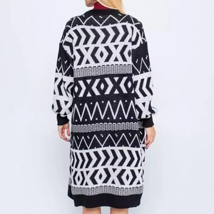 Back view of long black and white geometric knit cardigan with ribbed cuffs and hem