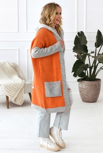 Detail view of longline hooded knit cardigan with contrast orange and grey color block panels