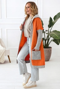Detailed knit texture of long hooded cardigan with orange and grey color block panels