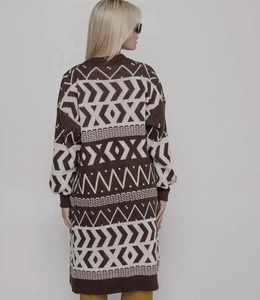 Detail of vintage jacquard knit cardigan featuring geometric patterns and brown ribbed cuffs
