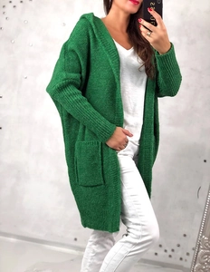 Detailed view of green cable knit hooded cardigan with front pockets and ribbed texture