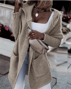 Detail of light camel knit hooded cardigan featuring large pockets and ribbed cuffs