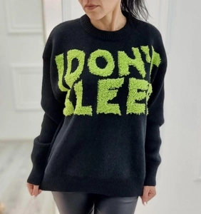 Women's black crewneck knit sweater with green PONY LEE text and drop shoulders