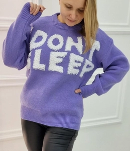 Detail of purple crewneck knit sweater featuring plush DON'T SLEEP white lettering