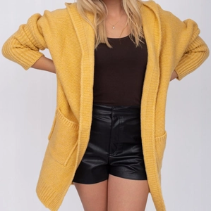 Detailed knit texture of mustard yellow hooded cardigan with large functional pockets