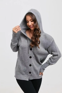 Detail view of solid gray hooded cardigan featuring large black buttons and ribbed knit cuffs