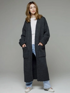 Detail of dark grey oversized knit cardigan showing thick texture and large side pockets