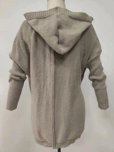 Detail of khaki chunky knit hoodie sweater featuring ribbed cuffs and back seam design