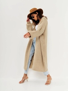 Close-up detail of warm beige long knit cardigan featuring premium ribbed texture and open front