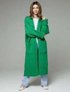 Detail view of bright green long knit cardigan with ribbed cuffs and large patch pockets