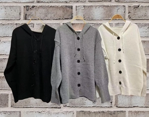 Detail of hooded knit cardigan featuring drawstring, buttons, and ribbed cuffs in three colors