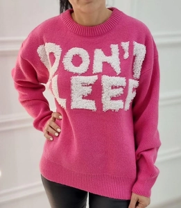 Detailed knit texture of rose red crewneck sweater with white plush letter embroidery