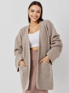 Detailed view of oversized knit cardigan with two large front pockets in oatmeal color