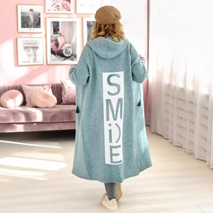 Cozy light blue long knit hooded cardigan with SMILE back lettering in a loose fit