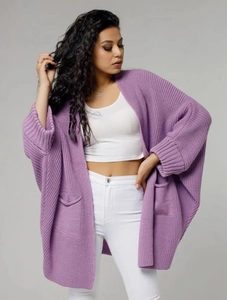 Close-up of lilac knit cardigan showing textured pockets and batwing sleeve detail