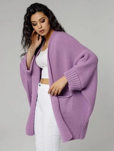 Close-up of a purple chunky knit cardigan with batwing sleeves and large front pockets