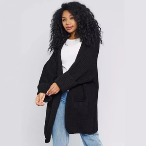 Relaxed black knit cardigan for women with large pockets and textured vertical ribbing pattern