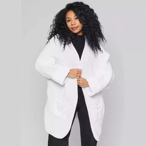 Loose white long sleeve knitted cardigan with large front pockets and ribbed cuffs