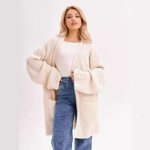 Cream oversized knit cardigan with side pockets and dropped shoulders for women