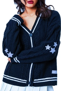 Detail of navy knit cardigan with cable stitch, contrast stripes and white star patches