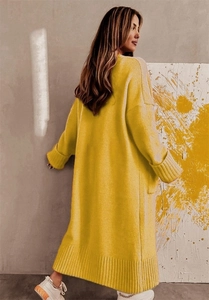 Detail view of mustard yellow oversized long knit cardigan with ribbed cuffs and hem
