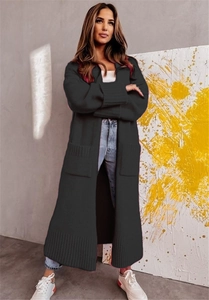 Detailed view of women long knit cardigan featuring ribbed cuffs and large side pockets