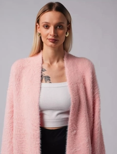 Close-up of soft pink faux mink fur cardigan with loose knit texture and open collar