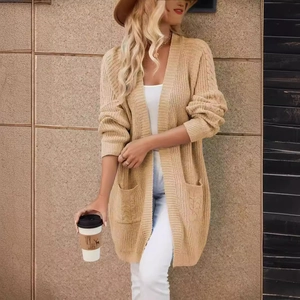 Long chunky knit cardigan in beige featuring cable knit pockets and relaxed open front style