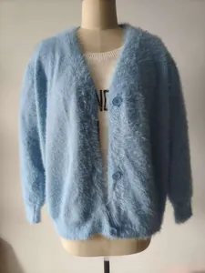 Close-up of light blue mink velvet cardigan with V-neckline and fuzzy knit texture