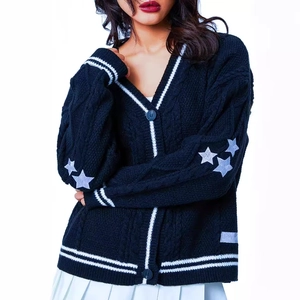 Women's black knit cardigan with white star patches and stripe trim in preppy style