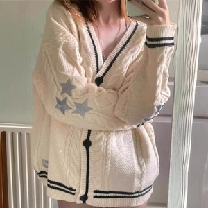 Beige knit cardigan with star patches, V-neck, and striped trim in casual preppy style