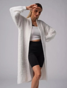 Detail of white faux mink fur cardigan showing soft texture and cozy oversized knit fit