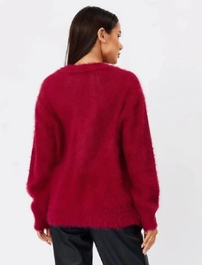 Back view of a fluffy fuchsia mink-style knit sweater with soft plush texture in loose fit