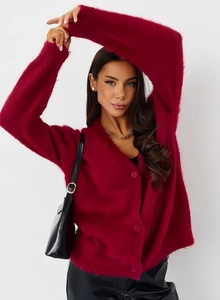 Close-up of deep red mink fur cardigan showing soft V-neck and plush knit texture