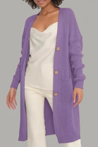Detail of purple knitted cardigan with vertical ribbed texture and dark wooden buttons
