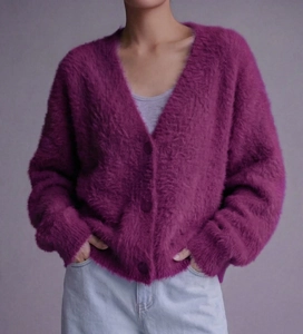 Detail of soft purple mink-like knit cardigan showing V-neck and plush texture