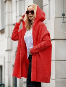 Close-up of bright red oversized hooded knit cardigan with detailed coarse wool texture