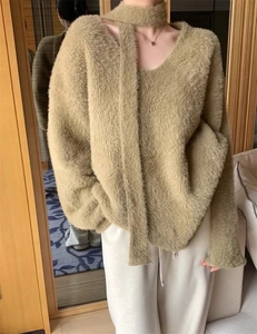 Detail of khaki faux mink fur sweater with matching scarf and soft fuzzy texture