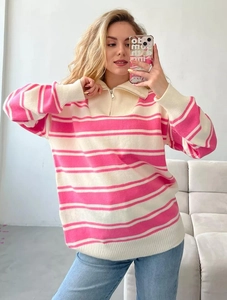 Detail view of pink and white striped knit sweater with half-zip collar design