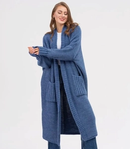 Detailed view of the gray-blue chunky knit cardigan with ribbed cuffs and large side pockets