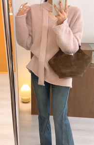 Pink faux mink knit sweater with scarf collar detail and vintage flared blue denim jeans