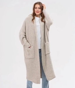 Detailed view of long chunky knit oatmeal cardigan with large front pockets and ribbed trim